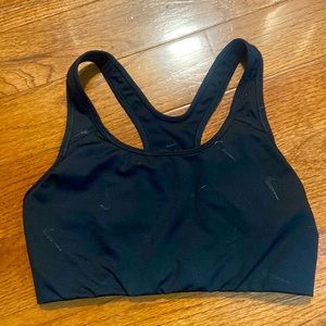 Size medium Nike womens sports bra in black with Nike symbol
